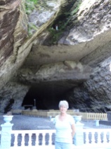 Mom at the grotto- look at the top and you'll see statues of St. Bernadette and Mary